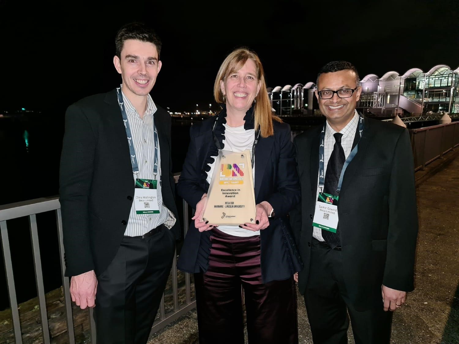 Chris Wellington, Andrea Rickard and Samir Govind. Andrea holds the Excellence in Innovation Trophy